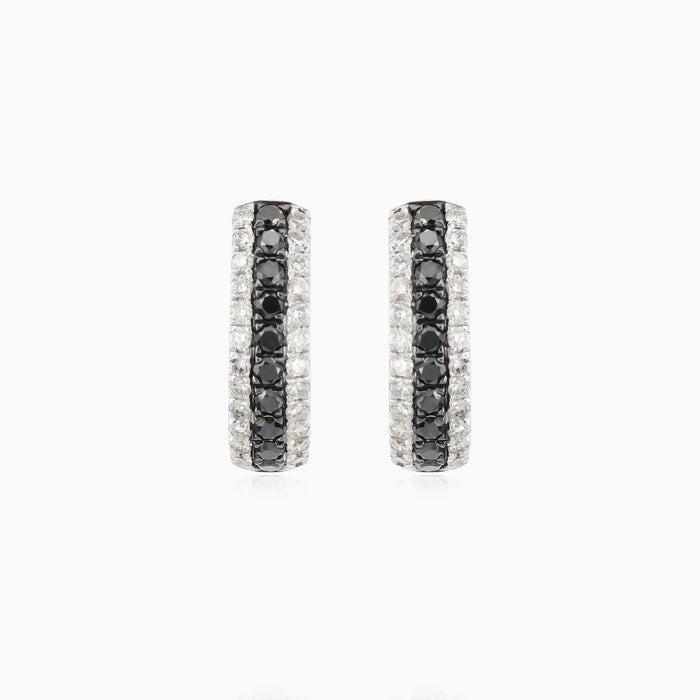 Shiny rose gold earrings with black and white diamonds
