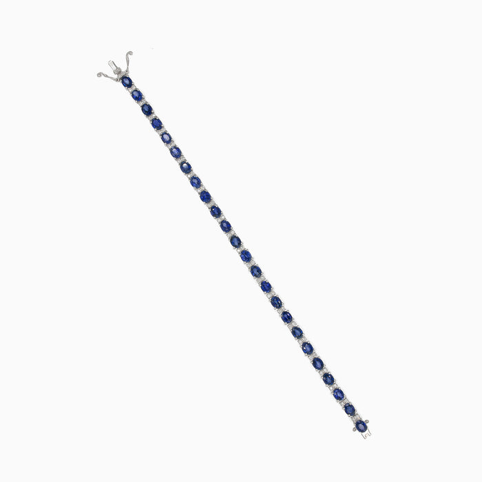 Gold tennis bracelet with sapphire and diamonds