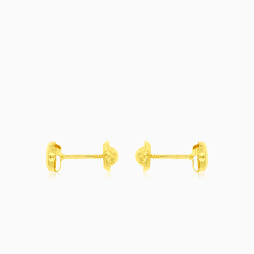 Round cut cubic zirconia stud earrings in yellow gold