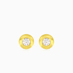 Round cut cubic zirconia stud earrings in yellow gold