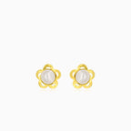Gold earrings with an engraved flower outline and a white round pearl