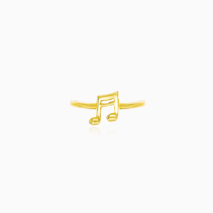 Anillo dorado con nota musical