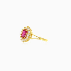 Lustrous cubic zirconia and oval ruby yellow gold ring