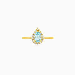 Pear cut blue topaz halo ring