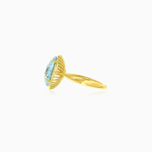 Faceted blue topaz gemstone gold ring