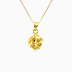 Yellow gold high polished knot pendant