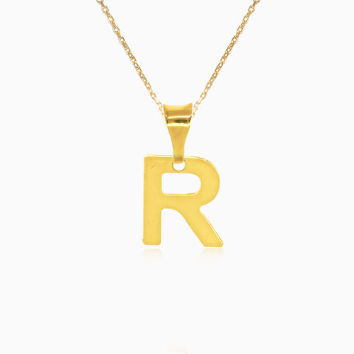 Gold pendant of letter "R"
