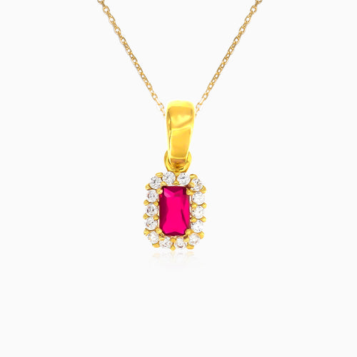 Emerald cut ruby and cubic zirconia halo pendant in yellow gold