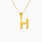 Gold pendant of letter H