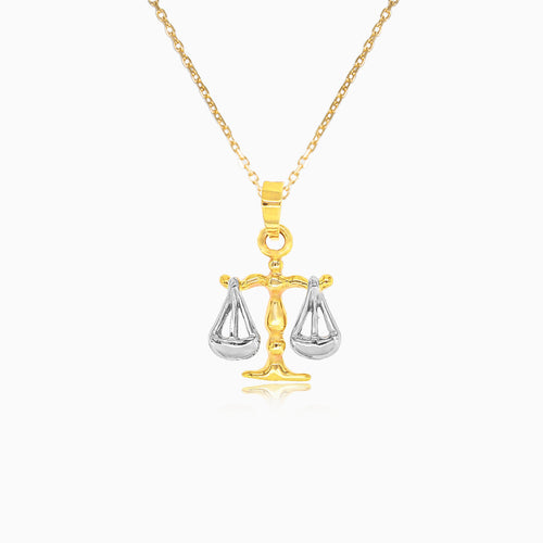 Golden pendant of the sign of Libra