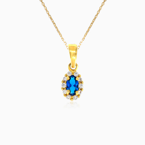 Gold oval cut blue sapphire pendant with cubic zirconia