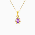 Oval cut amethyst and halo of cubic zirconia pendant in yellow gold