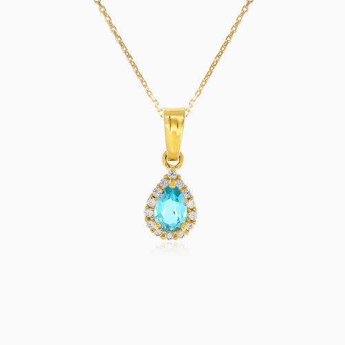 Blue topaz and cubic zirconia halo gold pendant