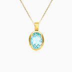 Gold pendant with oval topaz