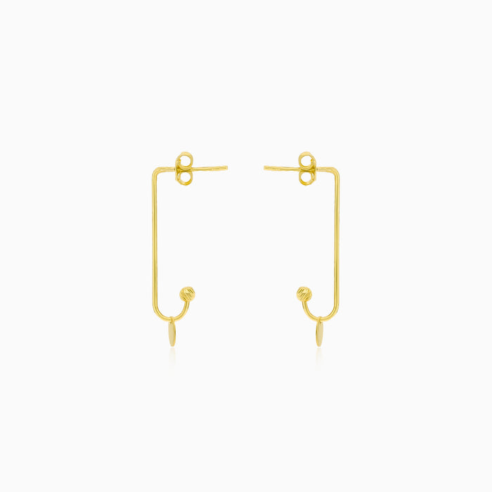 Unique gold earrings with a coin
