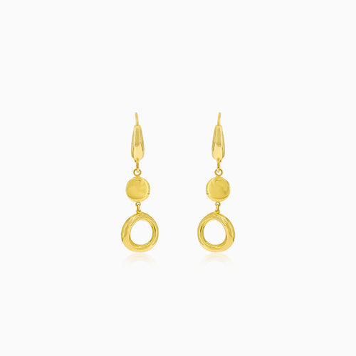 Gold dangling earrings with a circle and a coin