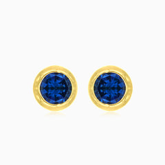 Blue Sapphire stud earrings in yellow gold