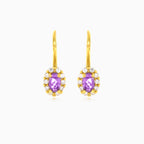 Oval cut purple amethyst yellow gold halo earrings