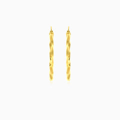 Yellow gold twist polished hoop earring