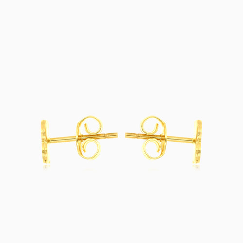 Symbolic yellow gold stud earrings
