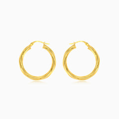 Twisted tube hoop earrings in yellow gold