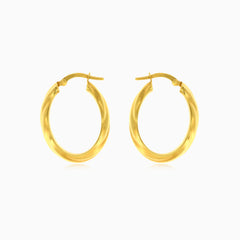 Yellow gold oval hoop earrings