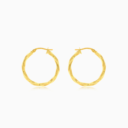 Twisted yellow gold hoop earrings