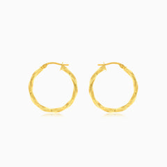 Twisted yellow gold hoop earrings