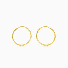 Diamond-cut gold hoop earrings