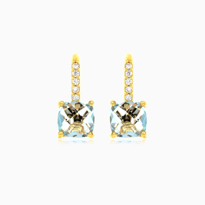 Pendientes de topacio azul y circonitas cúbicas en oro