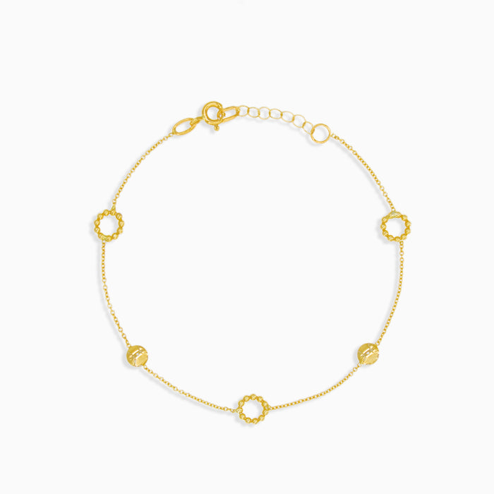 Pulsera de oro con círculos decorados
