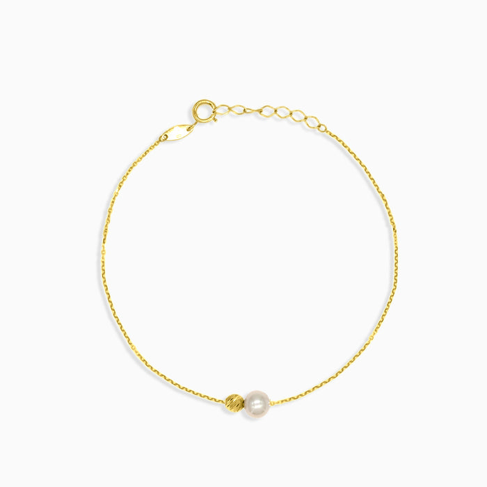 Pulsera con perla y bola de oro