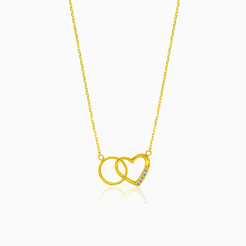 Gold necklace with heart and ring