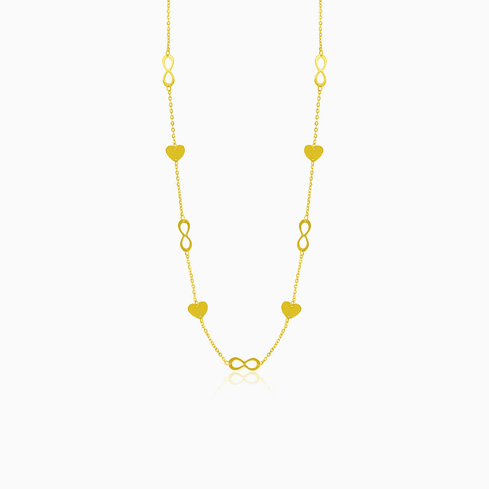 Gold necklace with hearts and infinity symbols