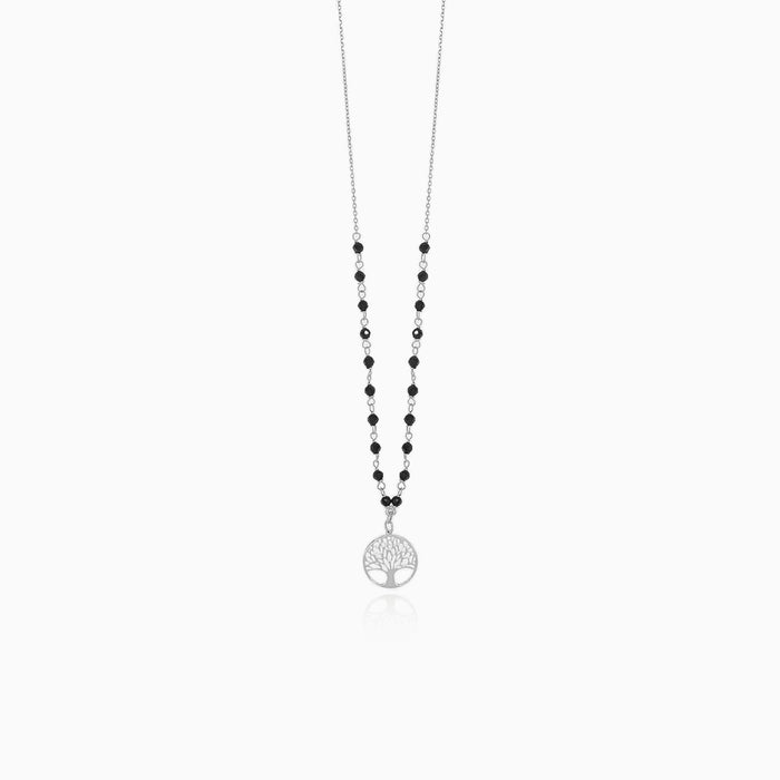 Magnifique collier en or blanc avec pendentif en onyx et arbre de vie.