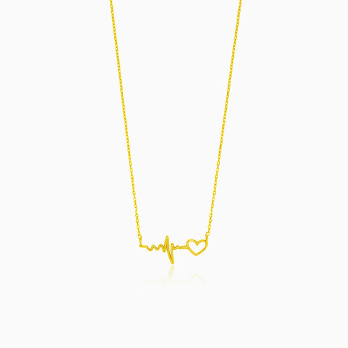 Gold necklace with heartbeat symbol