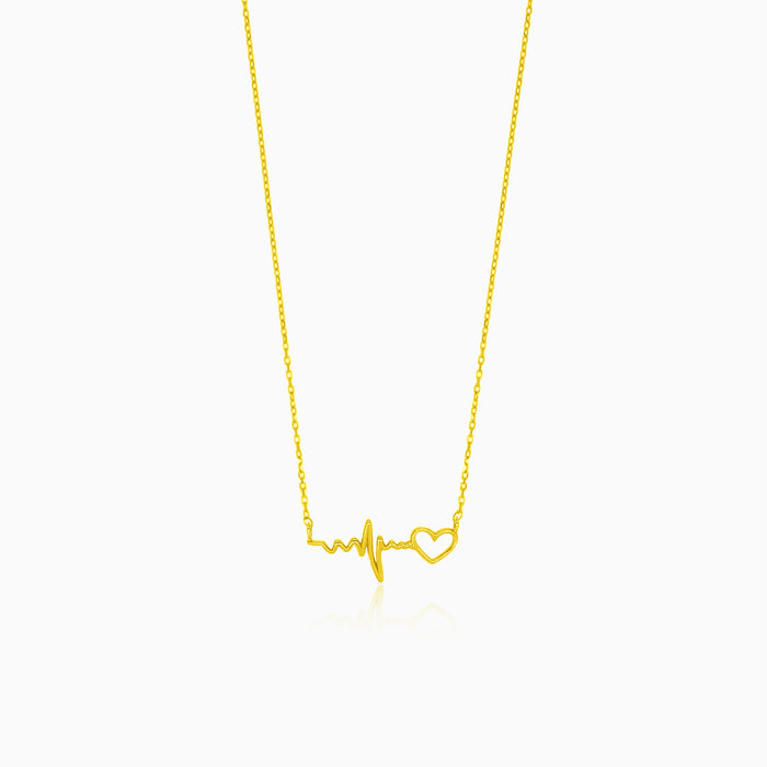 Gold necklace with heartbeat symbol