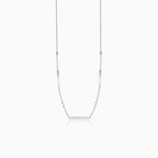 Minimalist necklace in white gold with balls and plate