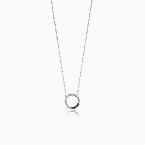 Elegant white gold necklace with a circle of onyx balls