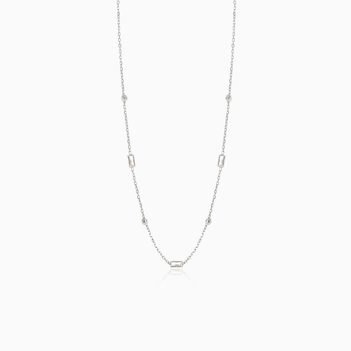 Fine necklace in white gold with balls and emerald cut zircons