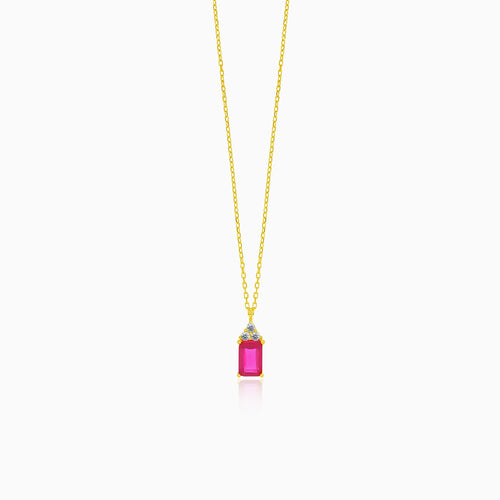 A beautiful gold necklace with a synthetic ruby pendant