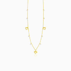 Gold necklace with hearts and zircons