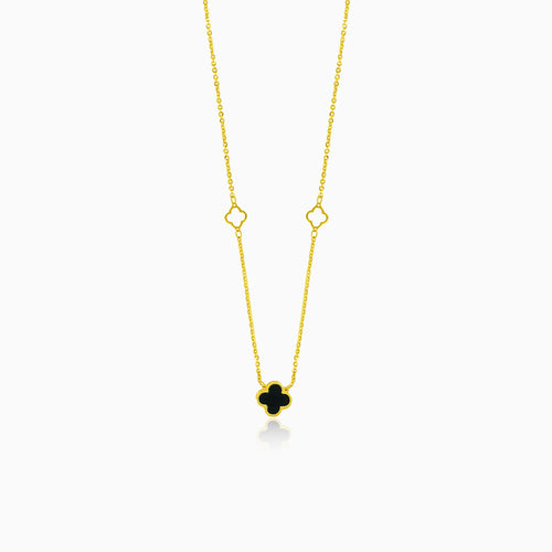 Gold necklace with black clover leaf