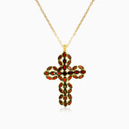 Graceful garnet and gold cross pendant