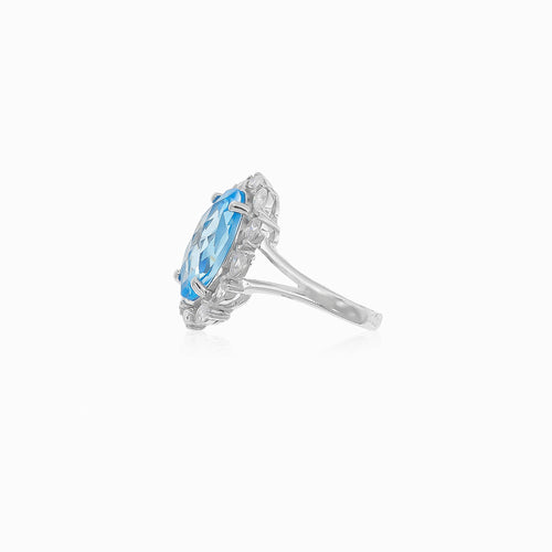 Stříbrný prsten Halo s modrým topazem a kubickými zirkony