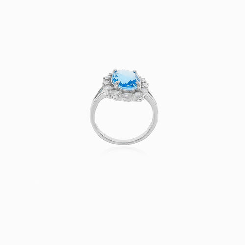 Halo silver blue topaz and cubic zirconia ring