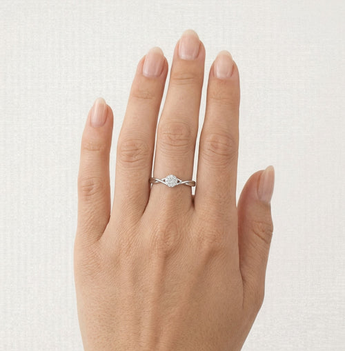 Sparkling white gold engagement ring with unique twist