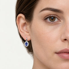 White gold tanzanite and diamond halo earrings