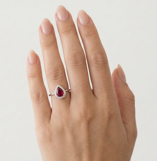 White gold pear cut ruby ring with diamonds