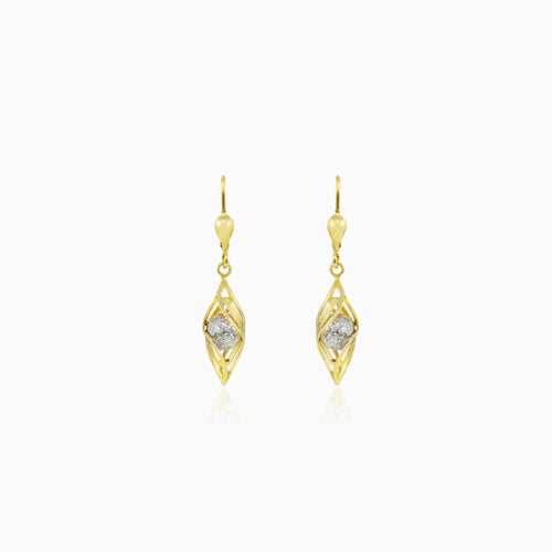 Dangling spiral gold earrings with a ball